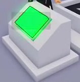 Production console with a green sloped button and white pedestal.